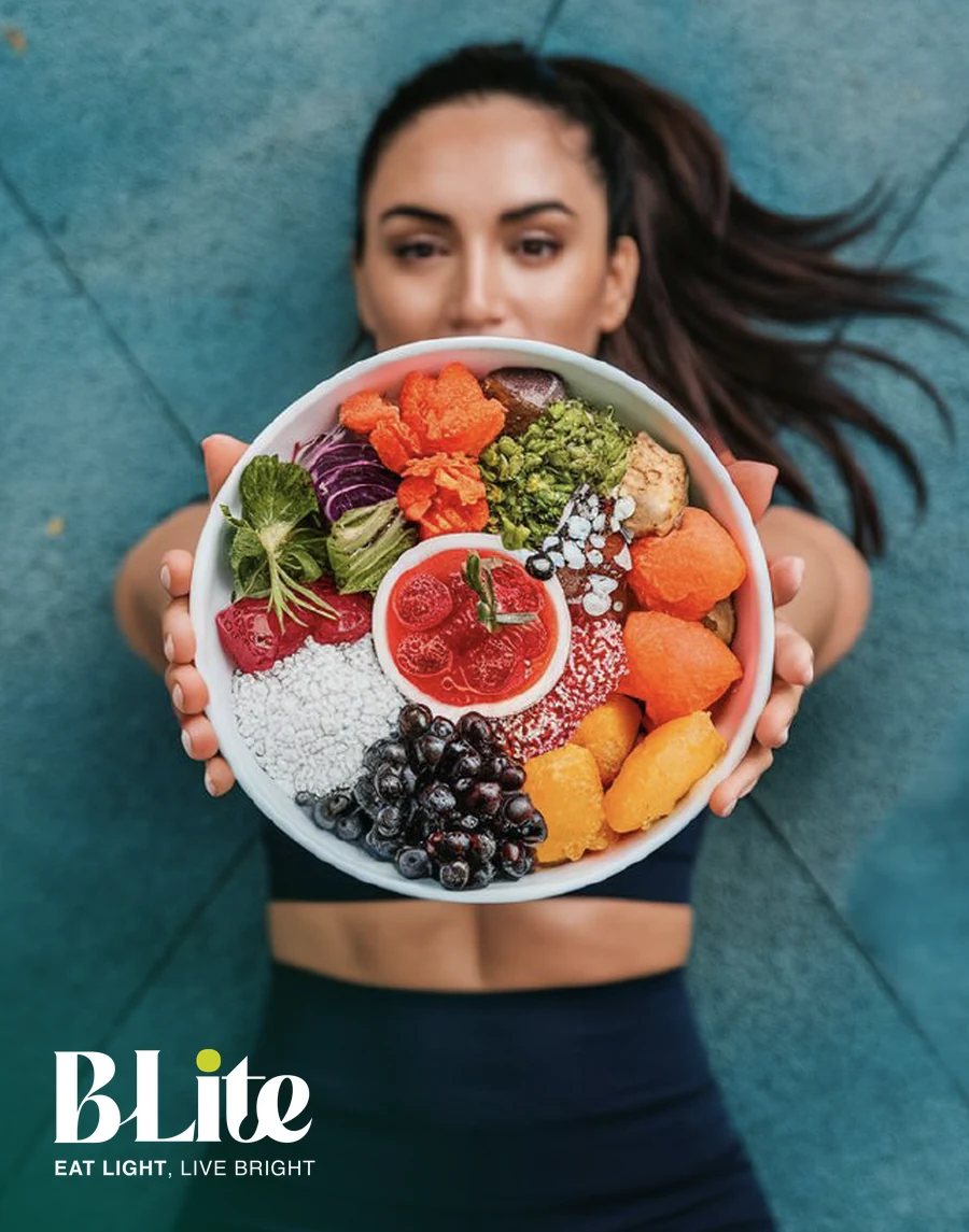 A BLite client holding a bowl of fresh fruit and vegetables